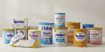 Assortment of baby formula brands and types on a table.