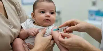 Healthcare professional administering a vaccine to a calm baby, emphasizing gentle care and safety.
