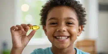 Happy child holding fish oil supplement for brain development