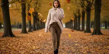 Woman in oversized knit sweater and tailored trousers for fall fashion